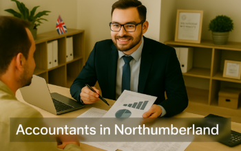 A professional accountant in a modern Northumberland office explains financial charts to a client across a tidy desk with a laptop, spreadsheets, and calculators. A small British flag and HMRC document in the background suggest a UK business setting. Overlay text reads Accountants in Northumberland